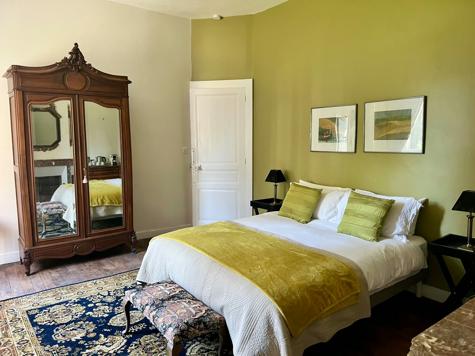 La Chambre Palerme — king-size bed with antique wardrobe and chartreuse accents