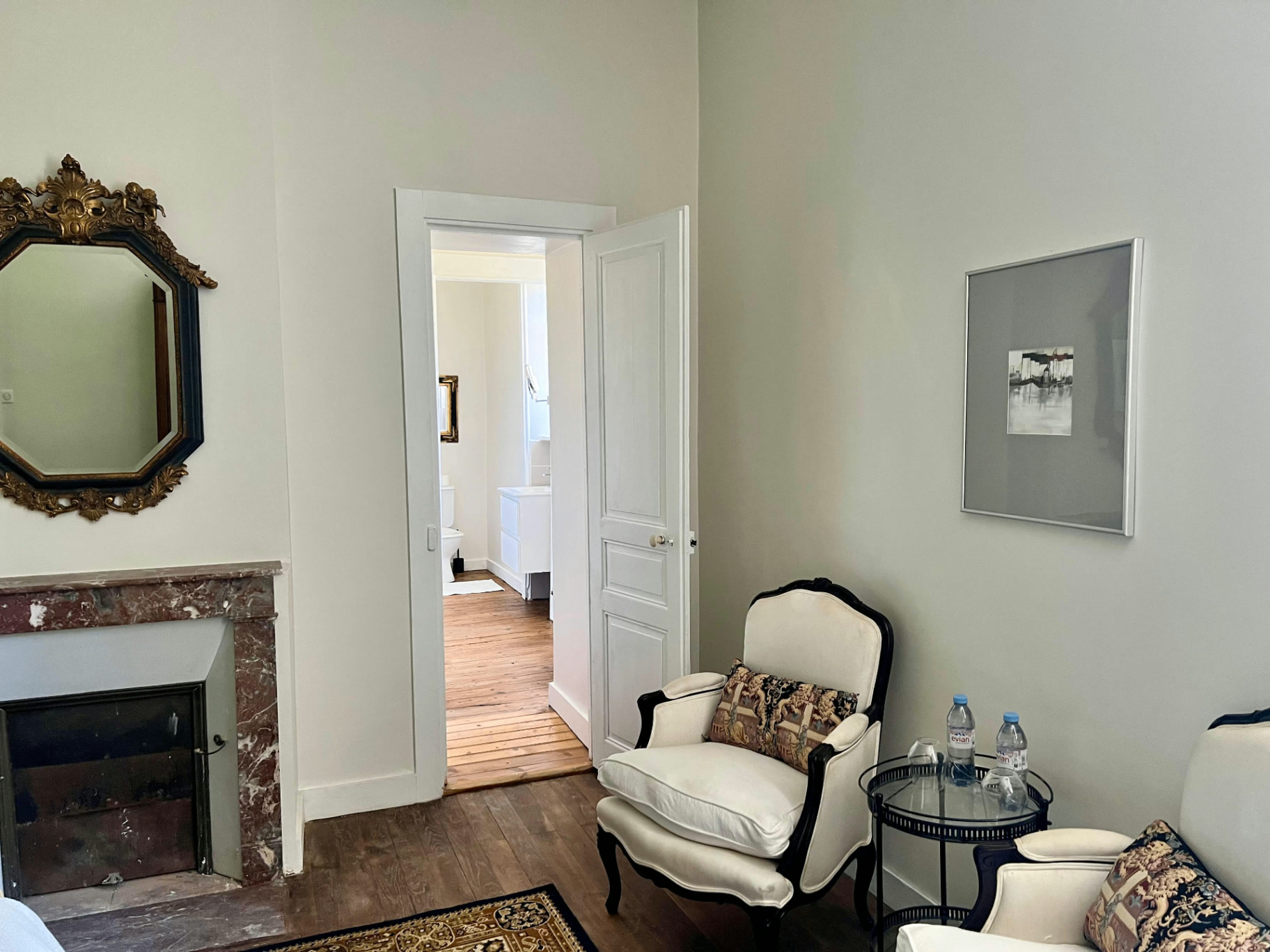 La Chambre Palerme — classic armchairs and marble mantelpiece